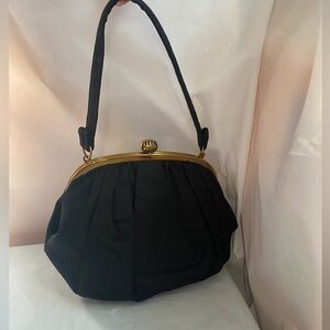 Chic Black Satchel with Gold Accents